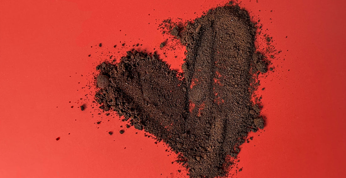 Heart healthy supplement powder laid out across a red background, in the shape of a heart. 