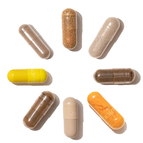 Herbal supplement capsules in facing vertically in the shape of a circle.