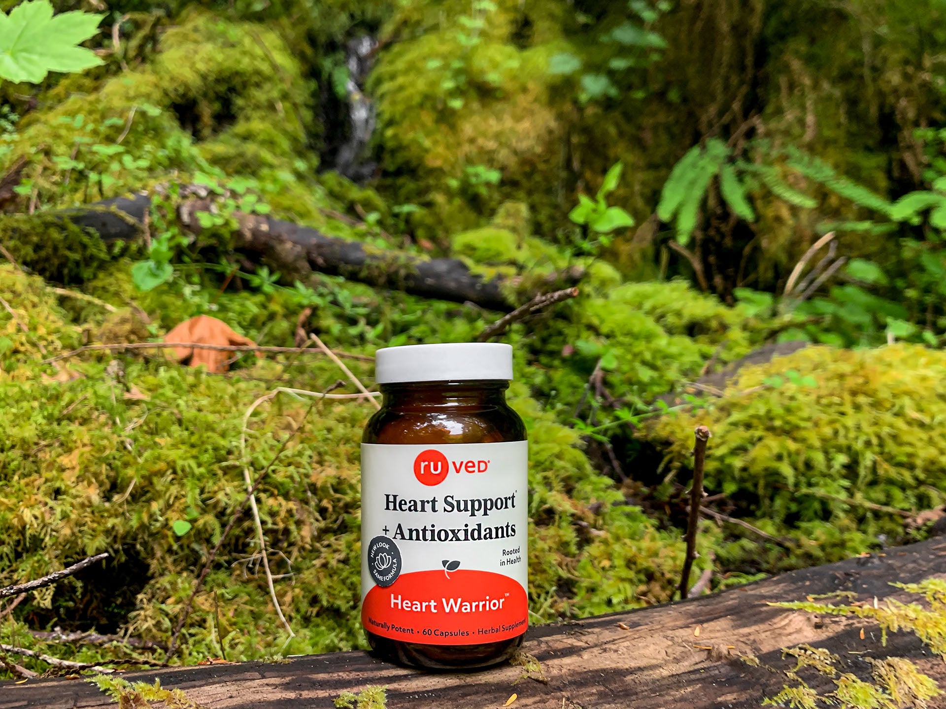 Heart Warrior Supplement: Enhancing cardiovascular wellness, nestled on a natural log backdrop.